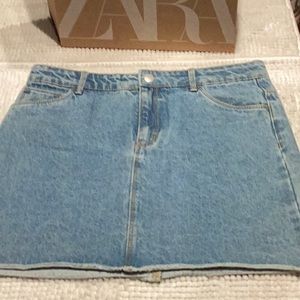 Jean skirt. Mini Skirt. From Spain. 28” waist. Adjustable waist band with button
